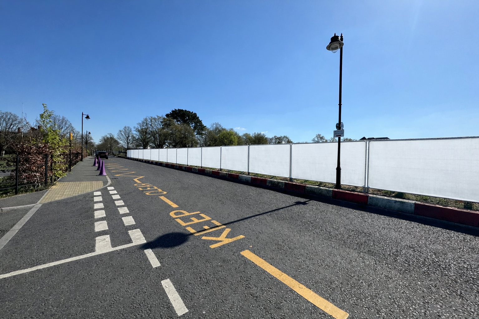Heras hoarding panels along a roadside
